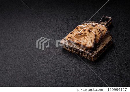 Christmas Stollen, a German sweet cake with marzipan and fruit. Winter Christmas Stollen 129994127