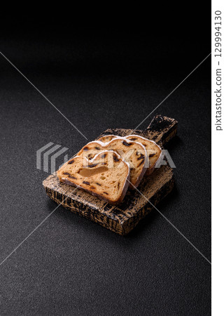 Christmas Stollen, a German sweet cake with marzipan and fruit. Winter Christmas Stollen 129994130