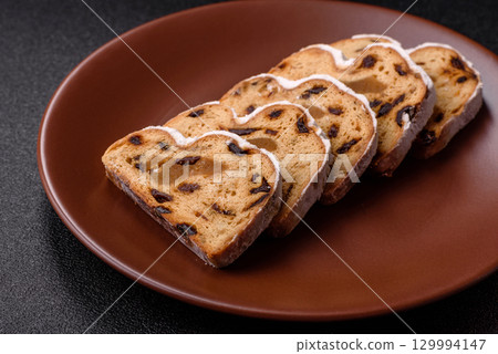 Christmas Stollen, a German sweet cake with marzipan and fruit. Winter Christmas Stollen 129994147