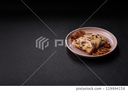Christmas Stollen, a German sweet cake with marzipan and fruit. Winter Christmas Stollen 129994158