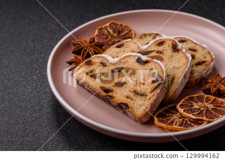 Christmas Stollen, a German sweet cake with marzipan and fruit. Winter Christmas Stollen 129994162