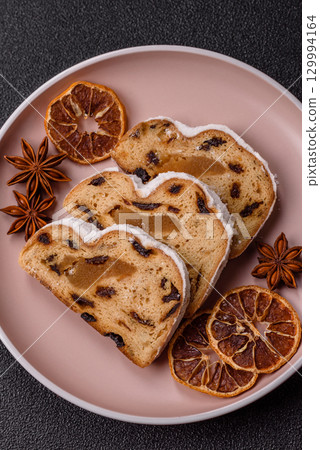 Christmas Stollen, a German sweet cake with marzipan and fruit. Winter Christmas Stollen 129994164