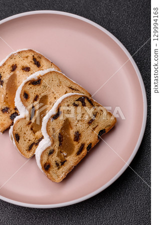 Christmas Stollen, a German sweet cake with marzipan and fruit. Winter Christmas Stollen 129994168