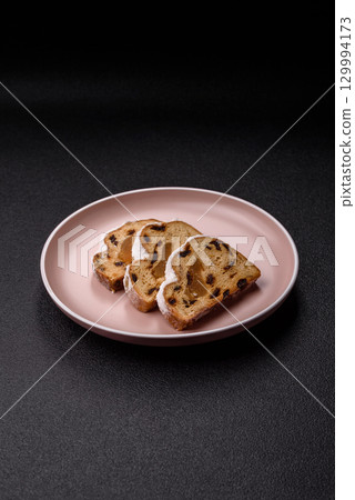Christmas Stollen, a German sweet cake with marzipan and fruit. Winter Christmas Stollen 129994173