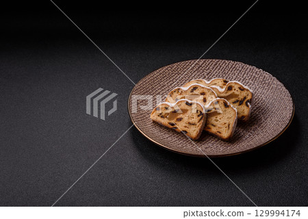 Christmas Stollen, a German sweet cake with marzipan and fruit. Winter Christmas Stollen 129994174