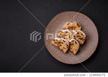 Christmas Stollen, a German sweet cake with marzipan and fruit. Winter Christmas Stollen 129994175