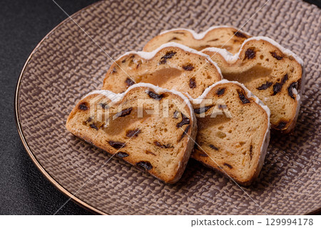 Christmas Stollen, a German sweet cake with marzipan and fruit. Winter Christmas Stollen 129994178