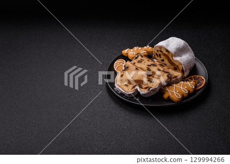 Christmas Stollen, a German sweet cake with marzipan and fruit. Winter Christmas Stollen 129994266