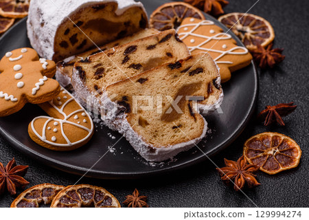Christmas Stollen, a German sweet cake with marzipan and fruit. Winter Christmas Stollen 129994274