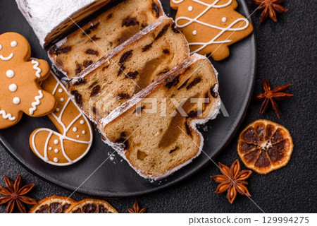 Christmas Stollen, a German sweet cake with marzipan and fruit. Winter Christmas Stollen 129994275