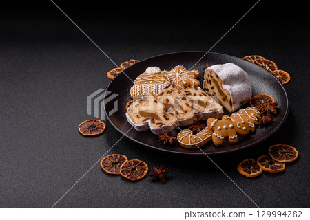Christmas Stollen, a German sweet cake with marzipan and fruit. Winter Christmas Stollen 129994282