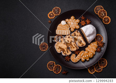 Christmas Stollen, a German sweet cake with marzipan and fruit. Winter Christmas Stollen 129994283
