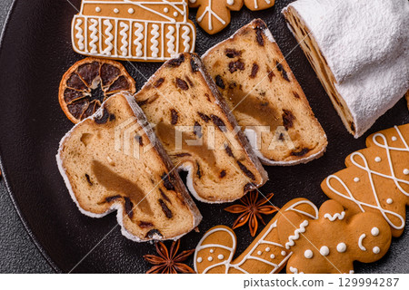 Christmas Stollen, a German sweet cake with marzipan and fruit. Winter Christmas Stollen 129994287