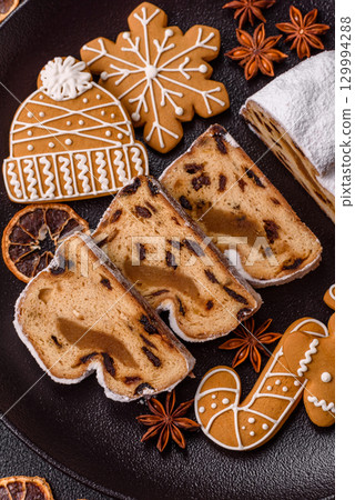 Christmas Stollen, a German sweet cake with marzipan and fruit. Winter Christmas Stollen 129994288
