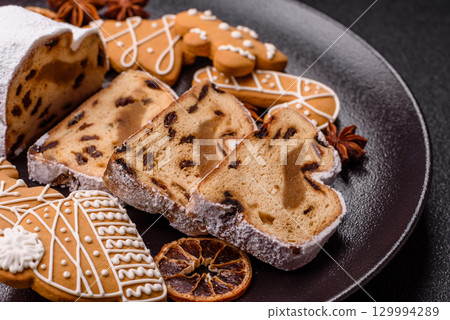 Christmas Stollen, a German sweet cake with marzipan and fruit. Winter Christmas Stollen 129994289