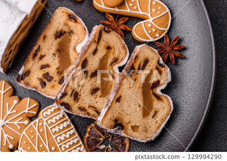 Christmas Stollen, a German sweet cake with marzipan and fruit. Winter Christmas Stollen 129994290