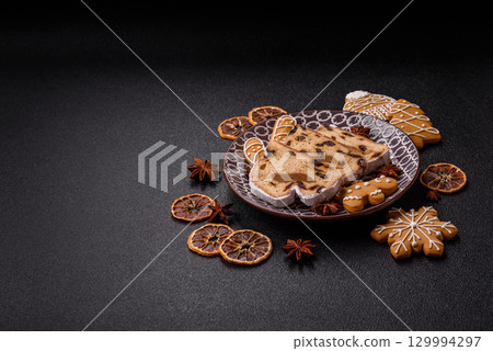 Christmas Stollen, a German sweet cake with marzipan and fruit. Winter Christmas Stollen 129994297