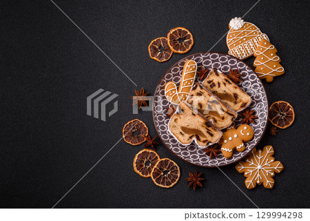 Christmas Stollen, a German sweet cake with marzipan and fruit. Winter Christmas Stollen 129994298