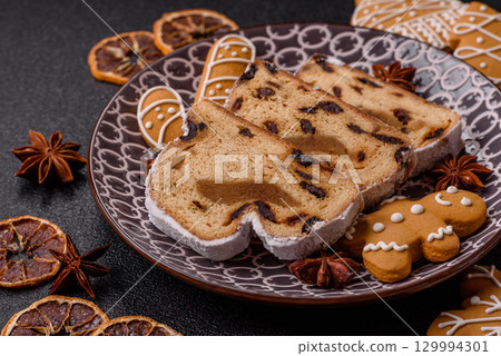 Christmas Stollen, a German sweet cake with marzipan and fruit. Winter Christmas Stollen 129994301