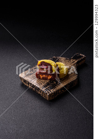 Chinese mooncake is an Asian sweet dessert. Asian mooncake as a background for your design 129994323