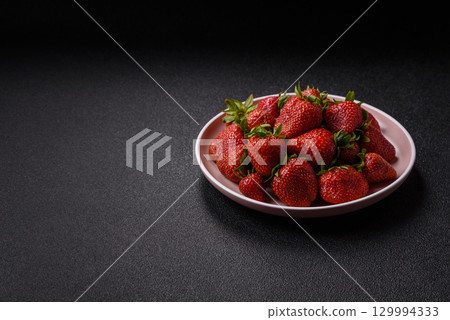Strawberry, fresh juicy berries and fruits as background Strawberry, fresh juicy berries and fruits as background 129994333