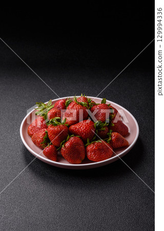 Strawberry, fresh juicy berries and fruits as background Strawberry, fresh juicy berries and fruits as background 129994336