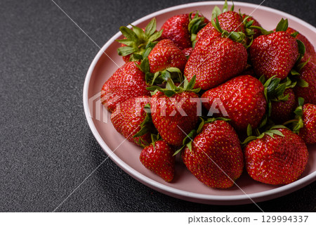 Strawberry, fresh juicy berries and fruits as background Strawberry, fresh juicy berries and fruits as background 129994337