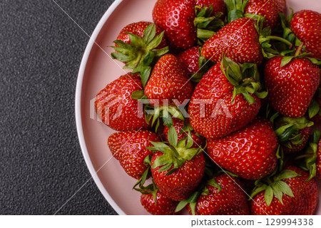 Strawberry, fresh juicy berries and fruits as background Strawberry, fresh juicy berries and fruits as background 129994338