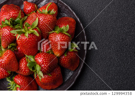 Strawberry, fresh juicy berries and fruits as background 129994358