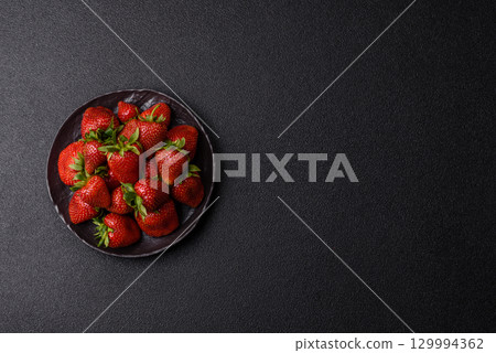 Strawberry, fresh juicy berries and fruits as background Strawberry, fresh juicy berries and fruits as background 129994362