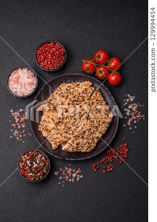 Crispbread, thin bread with seeds and grains, a baked cracker. Crispbread with sesame seeds 129994454