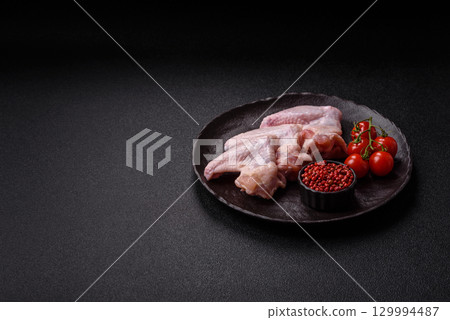 Raw chicken wings, fresh uncooked poultry meat. Chicken or turkey wings 129994487