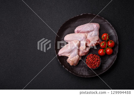 Raw chicken wings, fresh uncooked poultry meat. Chicken or turkey wings 129994488