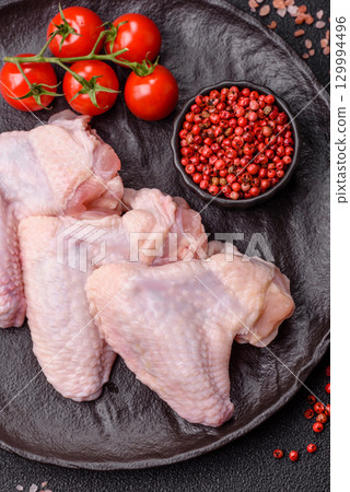 Raw chicken wings, fresh uncooked poultry meat. Chicken or turkey wings 129994496