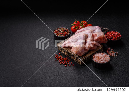 Raw chicken wings, fresh uncooked poultry meat. Chicken or turkey wings 129994502