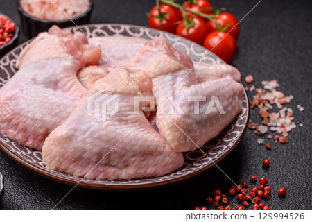 Raw chicken wings, fresh uncooked poultry meat. Chicken or turkey wings 129994526
