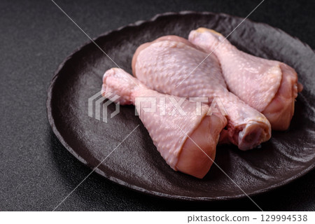 Raw chicken legs, fresh uncooked poultry meat. Chicken or turkey legs 129994538