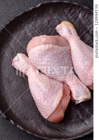 Raw chicken legs, fresh uncooked poultry meat. Chicken or turkey legs 129994539