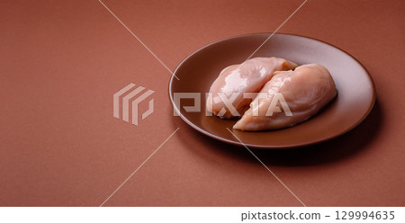 Meat, raw chicken fillets, poultry breast, skinless and boneless food. Raw chicken fillet Meat, raw chicken fillets, poultry breast, skinless and boneless food. Raw chicken fillet 129994635