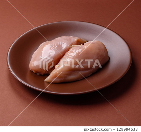 Meat, raw chicken fillets, poultry breast, skinless and boneless food. Raw chicken fillet 129994638