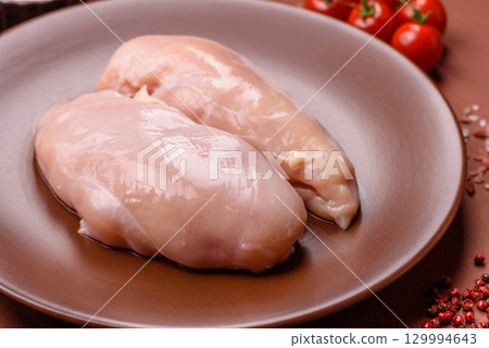 Meat, raw chicken fillets, poultry breast, skinless and boneless food. Raw chicken fillet 129994643
