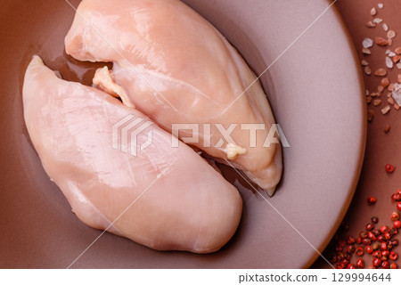 Meat, raw chicken fillets, poultry breast, skinless and boneless food. Raw chicken fillet Meat, raw chicken fillets, poultry breast, skinless and boneless food. Raw chicken fillet 129994644