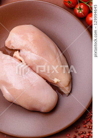Meat, raw chicken fillets, poultry breast, skinless and boneless food. Raw chicken fillet Meat, raw chicken fillets, poultry breast, skinless and boneless food. Raw chicken fillet 129994645