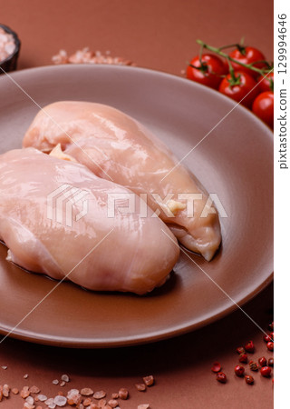 Meat, raw chicken fillets, poultry breast, skinless and boneless food. Raw chicken fillet Meat, raw chicken fillets, poultry breast, skinless and boneless food. Raw chicken fillet 129994646