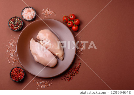 Meat, raw chicken fillets, poultry breast, skinless and boneless food. Raw chicken fillet Meat, raw chicken fillets, poultry breast, skinless and boneless food. Raw chicken fillet 129994648