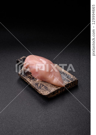 Meat, raw chicken fillets, poultry breast, skinless and boneless food. Raw chicken fillet Meat, raw chicken fillets, poultry breast, skinless and boneless food. Raw chicken fillet 129994665