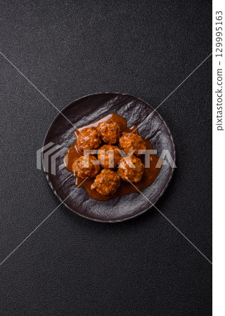 Meat, meatballs in tomato sauce, Italian food, beef or pork with salt . Meatballs with tomatoes 129995163