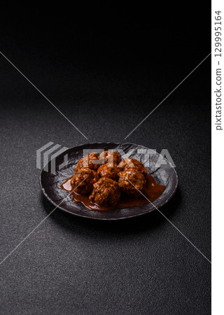 Meat, meatballs in tomato sauce, Italian food, beef or pork with salt . Meatballs with tomatoes 129995164