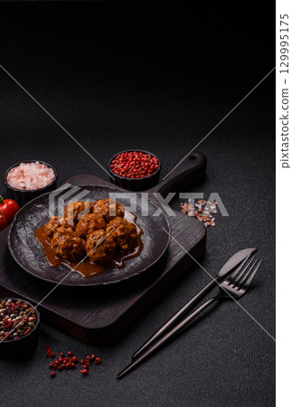 Meat, meatballs in tomato sauce, Italian food, beef or pork with salt . Meatballs with tomatoes 129995175