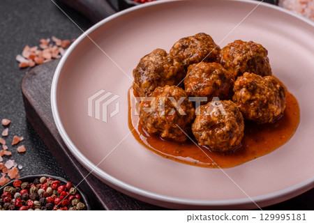 Meat, meatballs in tomato sauce, Italian food, beef or pork with salt . Meatballs with tomatoes Meat, meatballs in tomato sauce, Italian food, beef or pork with salt . Meatballs with tomatoes 129995181